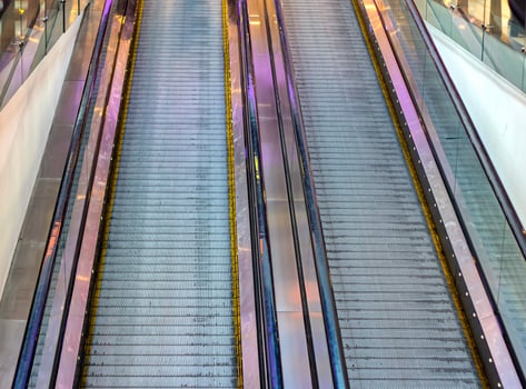 Lifting escalator. The descent into the subway, mall, underpass, moving stairs photo