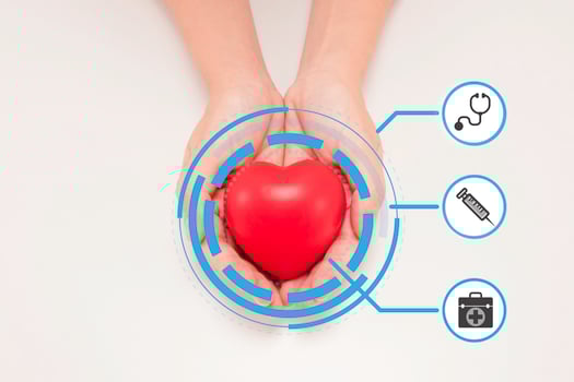 hand holding red heart with icon health care concept, on white background photo