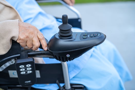 Asian senior or elderly old lady woman patient on electric wheelchair with remote control at nursing hospital ward, healthy strong medical concept photo