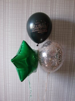 Blue balloon with words HAPPY BIRTHDAY on yellow background, space for text photo