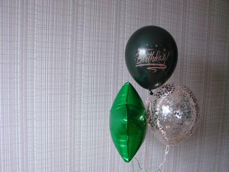 Blue balloon with words HAPPY BIRTHDAY on yellow background, space for text photo