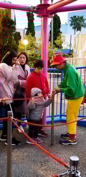 Osaka, Japan in April 2019. Children and several adults are queuing to enter a ride at Universal Studios Japan. photo