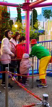 Osaka, Japan in April 2019. Children and several adults are queuing to enter a ride at Universal Studios Japan. photo