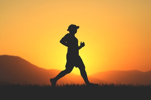 men's silhouette I am jogging to stay healthy in the evening. Men exercise by running. health care concept photo