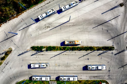 Aerial view from drone of bus at bus station with interesting shadows photo