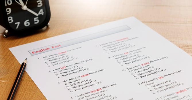 english exam on table with pencil photo