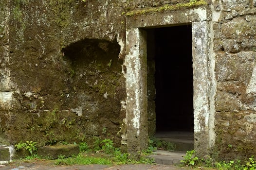Ancient stone doorway in the wall photo