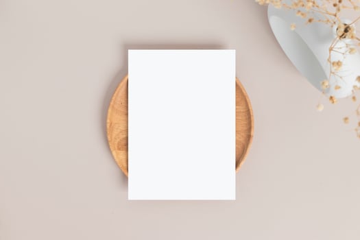 Blank greeting card invitation Mockup 5x7 on envelope with dry flowers and ribbon on paper background, flat lay, mockup photo