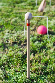 game of croquet on green lawn photo