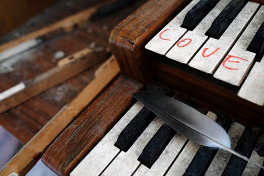 The word Love written on an old organ in an abandoned church photo