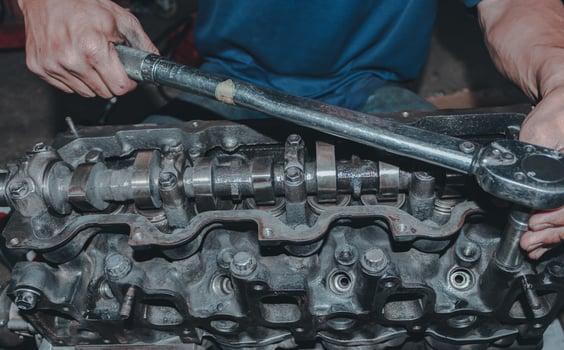 The mechanic is checking the engine. photo