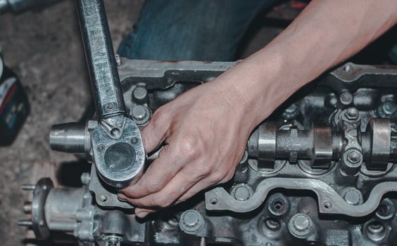 The mechanic is checking the engine. photo