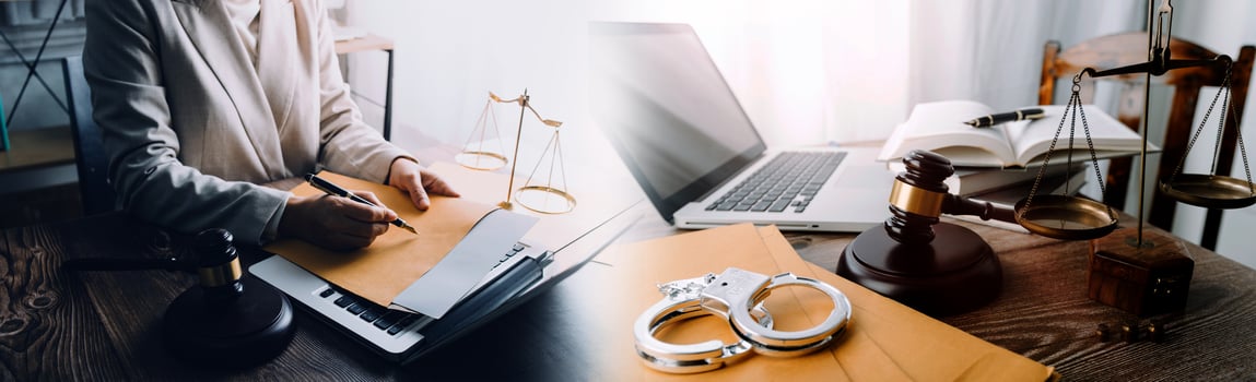Business and lawyers discussing contract papers with brass scale on desk in office. Law, legal services, advice, justice and law concept picture with film grain effect photo