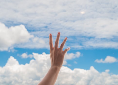 Praying hands on blue sky background,Young man prayed,Religion and spirituality with believe photo