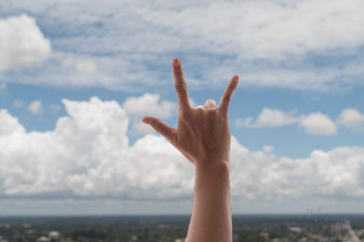 Praying hands on blue sky background,Young man prayed,Religion and spirituality with believe photo