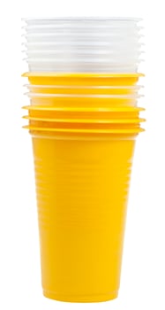 stack of yellow and transparent plastic cups photo