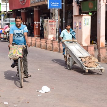 Old Delhi, India, April 15, 2022 - Unidentified group of men walking the streets of Old Delhi, Street Photography of Chandni Chowk market of Old Delhi during morning time, Old Delhi Street Photography photo