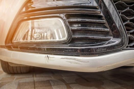car bumper scratched paint damage photo