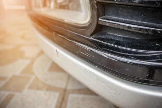 car bumper scratched paint damage photo