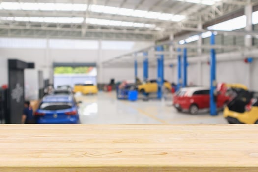 car service centre with auto at repair station bokeh light defocused blur background photo