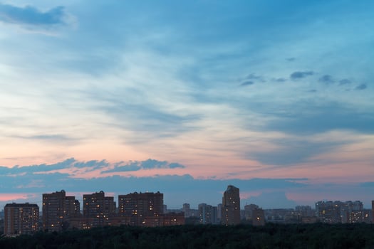 dark blue and pink night sky over urban street photo