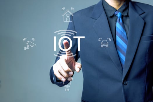 Businessman pushing IoT solutions photo