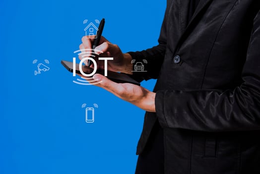 Internet of Things IoT concept. Business people press IoT solutions with symbols connected to common IoT icons. photo
