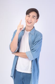 Portrait of young asian man over white background studio. photo