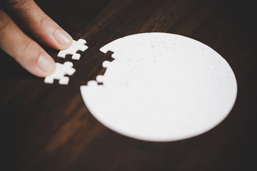 Business woman person hand with puzzle piece idea for strategy and solution. Closeup part of two white jigsaw connect together. Concept of join cooperation success teamwork-problem corporate team. photo