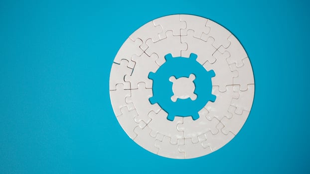 White part of jigsaw puzzle pieces on blue background. concepts of problem solving, business success, teamwork, Team playing jigsaw game incomplete, Texture photo with copy space for text