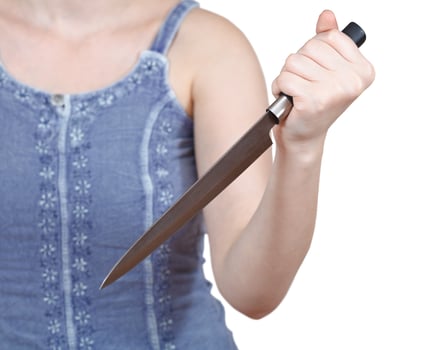 girl holding large kitchen knife photo