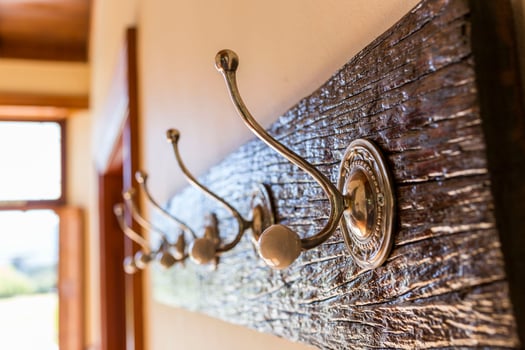 A closeup of wooden hanger on a wall photo