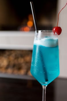 Blue cocktail with fireplace photo