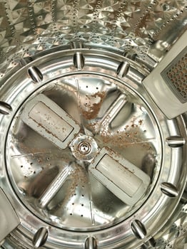 Dirt remain in a rotating drum tank inside the top loader washing machine, a device used to wash laundry photo