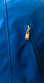zip pocket on blue jacket photo