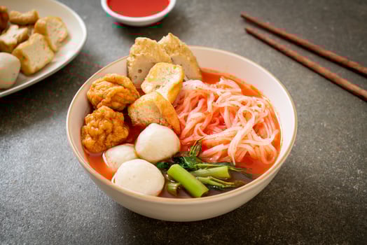 small flat rice noodles with fish balls and shrimp balls in pink soup, Yen Ta Four or Yen Ta Fo photo