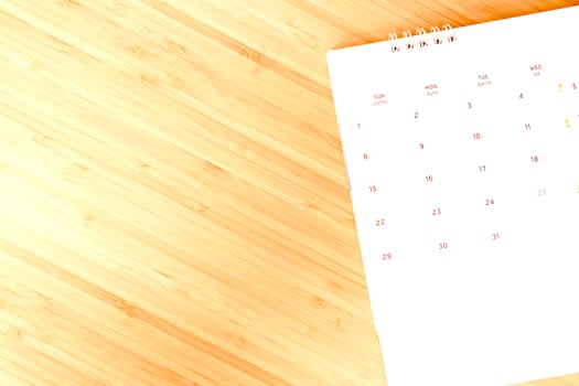 Birth control pills and condoms on a calendar date background calculate the date. control the birth rate health care and medicine photo