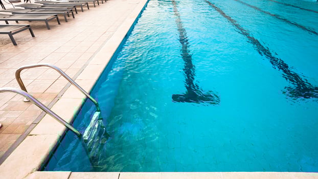 outdoor swimming pool with blue water photo