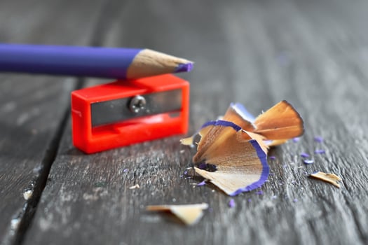 Pencil and sharpener on wooden table photo