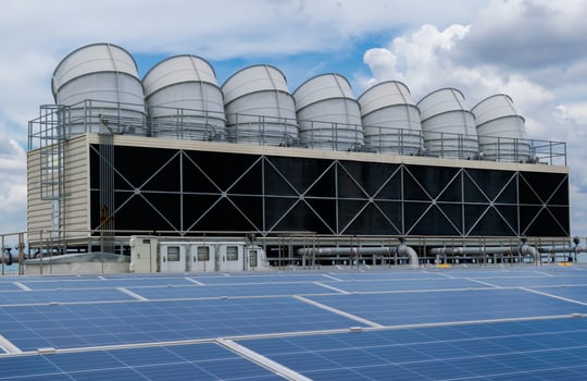 Hot climate and Sets of cooling towers cause increased power production,Alternative energy to conserve the world's energy, rooftop solar and cooling systems. photo