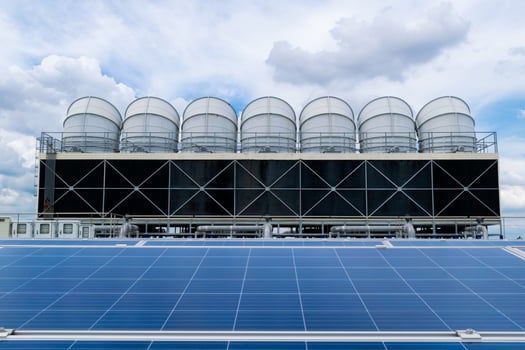 Hot climate and Sets of cooling towers cause increased power production,Alternative energy to conserve the world's energy, rooftop solar and cooling systems. photo