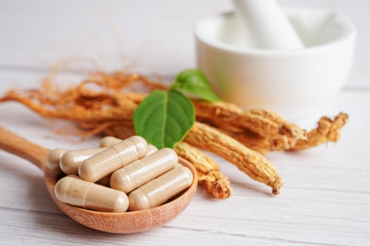 Ginseng roots and green leaf, healthy food. photo