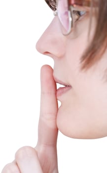 finger near lips close up - silence hand gesture photo
