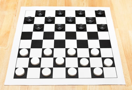 Starting position on vinyl checkers board photo