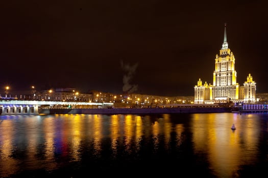 night view of Stalin's vysotka and Novoarbatsky bridge on in Moscow photo