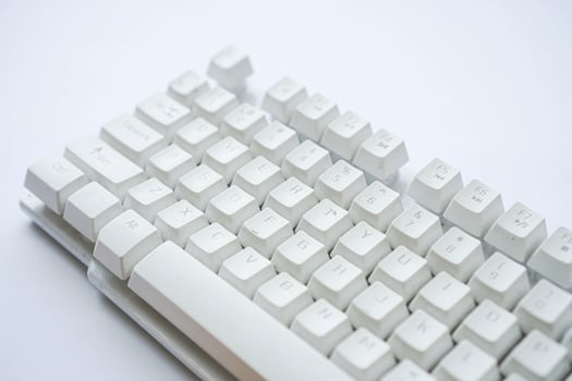 Used white computer keyboard that is not used until it gets dusty photo