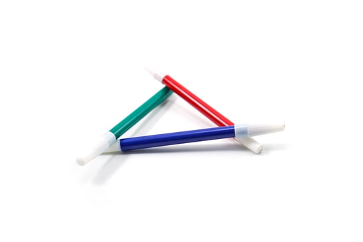 conceptual green, red, and blue triangular markers isolated on white photo