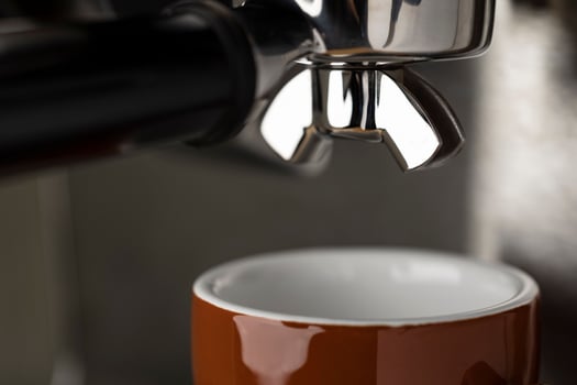 A closeup shot of an espresso coffee machine photo