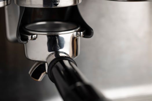 A closeup shot of an espresso coffee machine photo