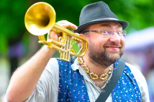 Balkan band street wind musician with his trumpet photo